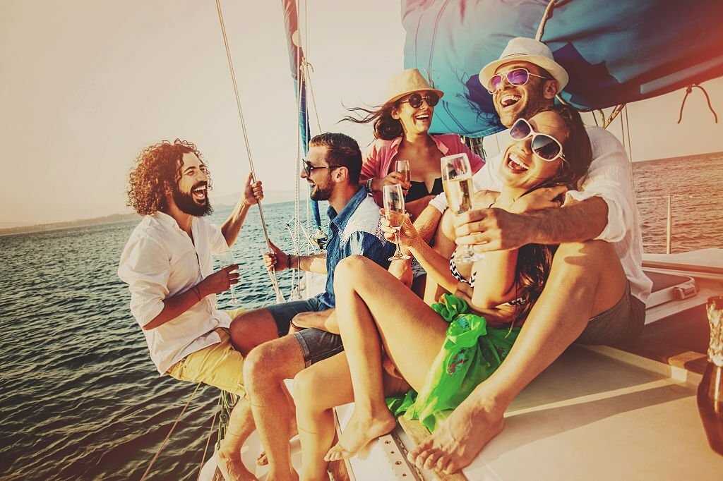 friends enjoying drinks at boat party.jpg